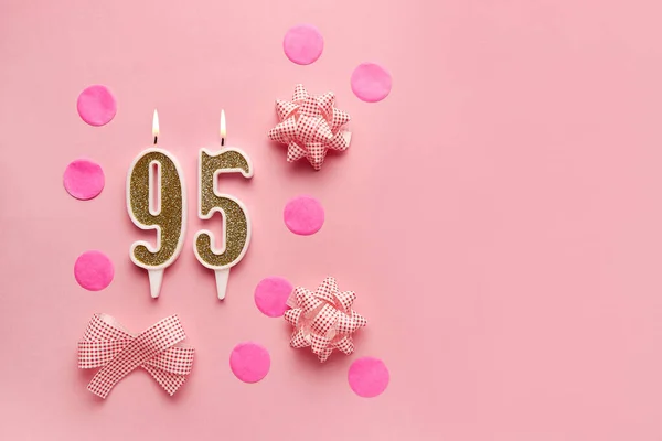 stock image Number 95 on pastel pink background with festive decor. Happy birthday candles. The concept of celebrating a birthday, anniversary, important date, holiday. Copy space. banner