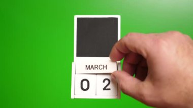 2 Mart tarihli takvim yeşil arka planda. Belirli bir tarihteki olay için illüstrasyon.