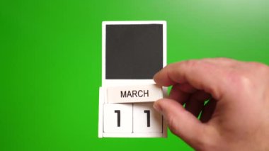 11 Mart tarihli takvim yeşil arka planda. Belirli bir tarihteki olay için illüstrasyon.