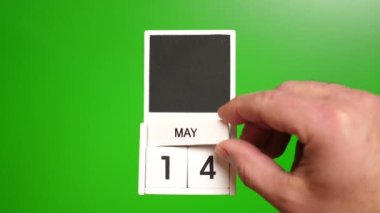 14 Mayıs tarihli takvim yeşil arka planda. Belirli bir tarihteki olay için illüstrasyon.
