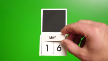 Yeşil arka planda 16 Mayıs tarihli takvim. Belirli bir tarihteki olay için illüstrasyon.