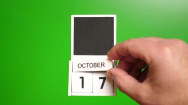 17 Ekim tarihli takvim yeşil arka planda. Belirli bir tarihteki olay için illüstrasyon.