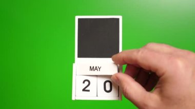 Yeşil arka planda 20 Mayıs tarihli takvim. Belirli bir tarihteki olay için illüstrasyon.