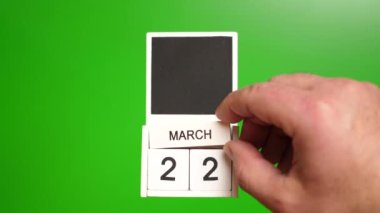 22 Mart tarihli takvim yeşil arka planda. Belirli bir tarihteki olay için illüstrasyon.