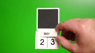 Takvim 23 Mayıs 'ta yeşil arka planda. Belirli bir tarihteki olay için illüstrasyon.