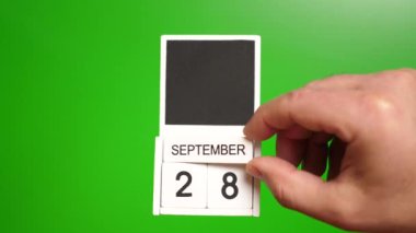 Takvim 28 Eylül 'de yeşil arka planda. Belirli bir tarihteki olay için illüstrasyon.