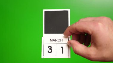 Yeşil arka planda 31 Mart tarihli takvim. Belirli bir tarihteki olay için illüstrasyon.
