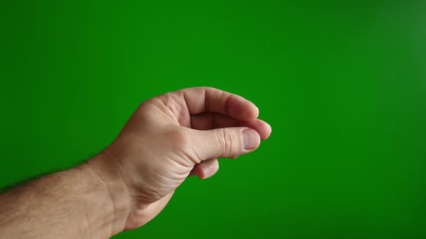 緑色の背景に男性の手の指をクリックします 簡単でシンプルなコンセプト スローモーション — ストック動画