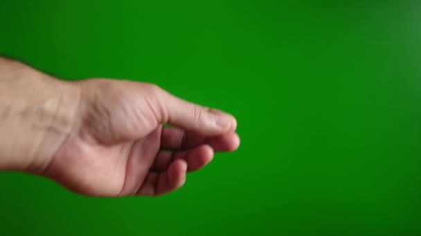 Man Shows Pay Cash Sign His Fingers Green Background — Stock Video