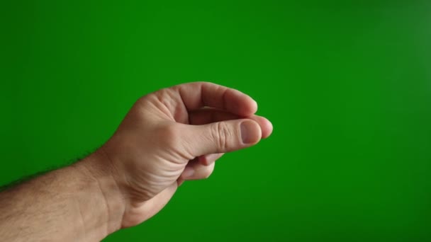 緑色の背景に男性の手の指をクリックします 簡単でシンプルなコンセプト スローモーション — ストック動画