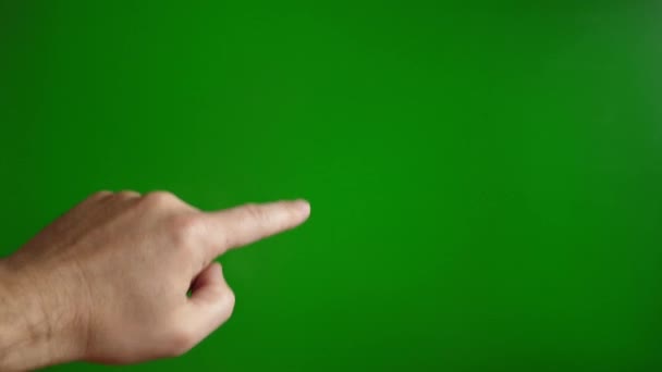 緑色の背景にある男の手がスクロールアップします タッチスクリーンの概念 — ストック動画