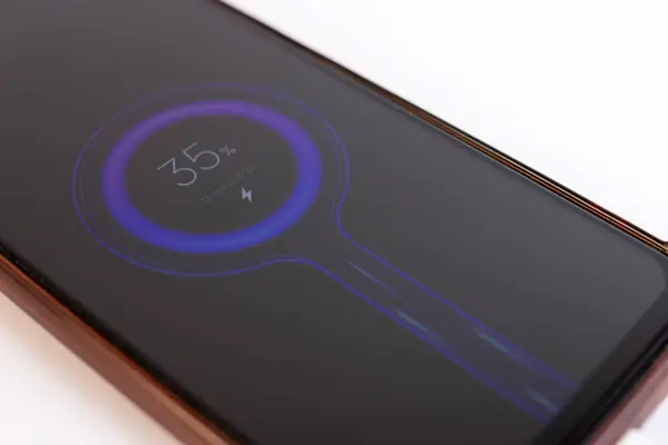 The smartphone is connected to fast charging. The process of charging gadgets.