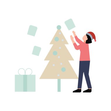 Çocuk Noel ağacını süslüyor..