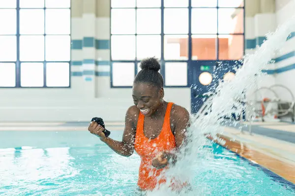 Black Young Woman Laughing While Being Strong Water Jet Heated — Stock Photo, Image