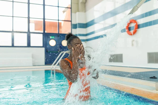 Black Young Woman Covering Her Face While Enjoying Water Jet — Stock Photo, Image