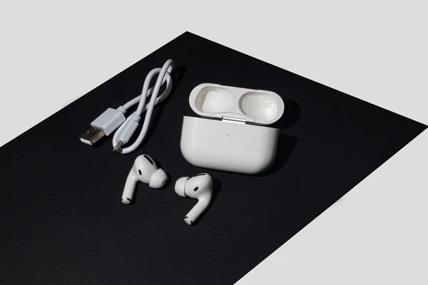 stock image White wireless headphones in a box. Isolate. Accessory for listening to music. copy space