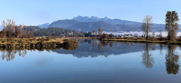 stock image Hazy winter morning reflections without snow