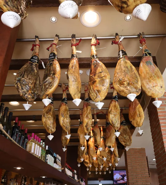 Stock image Prosciutto under restaurant ceiling in Granada