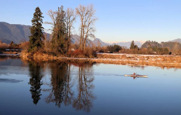 Early winter kayaking on the mirror reflections