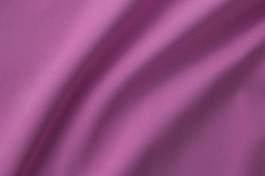 Dalgalı kumaş, pembe kumaş dokusu, pürüzsüz pembe farbric, pamuk, geleneksel kumaş deseni, üstte yakın plan..
