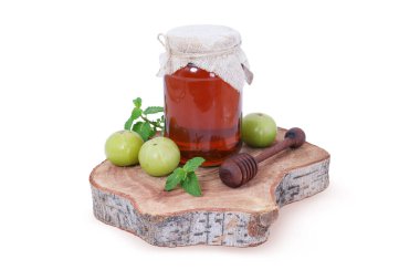 Taze Amla 'lı organik bal kavanozu ve kırsal ahşap tahta tahtada ahşap bal ayı. Doğal Ayurvedik Superfood.