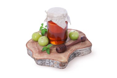 Taze Amla 'lı organik bal kavanozu ve kırsal ahşap tahta tahtada ahşap bal ayı. Doğal Ayurvedik Superfood.