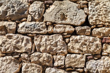 Farklı şekil ve büyüklükte taştan duvar. Arka plan
