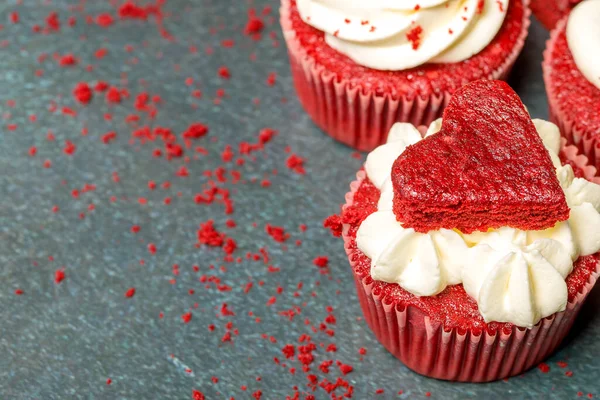 Valentine's day sweets. Red velvet cupcakes. Tasty cupcake with hearts. Festive background