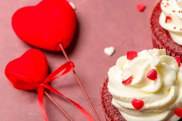 Valentine\'s day sweets. Red velvet cupcakes. Tasty cupcake with hearts. Festive background
