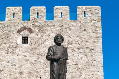 KUSADASI, TURKEY - JUNE 2, 2021: This is a monument to Admiral Aruj Barbarossa near the citadel of the Guverginada fortress. clipart