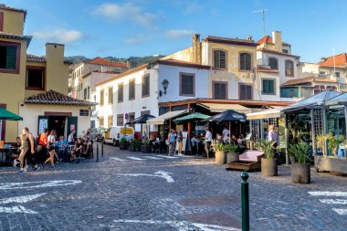 FUNCHAL, PORUGAL - AUGUST 20, 2021: This is a small square in the old seaside area of the city (Zona Velha) with many small cafes.