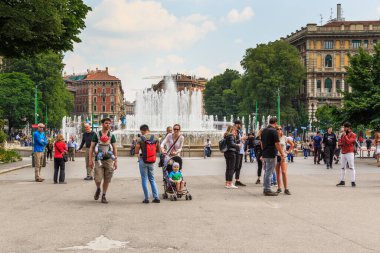 MILAN, ITALY - MAY 10, 2018: These are unidentified locals and tourists in the busy Garibaldi Square at the Wedding Cake Fountain.