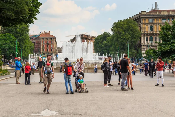 MILAN, ITALY - MAY 10, 2018: These are unidentified locals and tourists in the busy Garibaldi Square at the Wedding Cake Fountain.