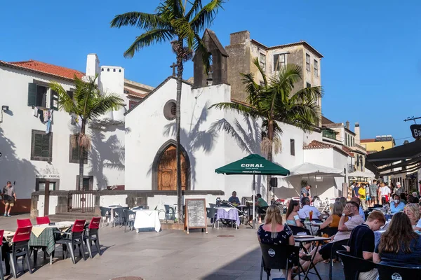 stock image FUNCHAL, PORTUGAL - AUGUST 20, 2021: This is a small square near the medieval chapel (Capela do Corpo Santo) in the old seaside area of the city (Zona Velha), surrounded by many cafes and restaurants.