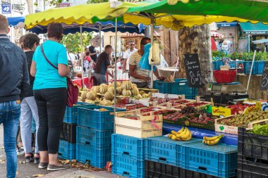 ROUEN, FRANCE - AUGUST 31, 2019: These are the food stalls of a street market on the old Market Square of the city.