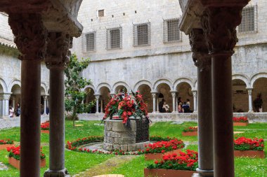 GIRONA, SPAIN - MAY 14, 2017: This is the cloister of a medieval cathedral decorated for the annual Flower Festival.