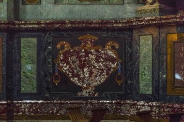 FLORENCE, ITALY - SEPTEMBER 13, 2018: This is a fragment of the marble mosaic in the interior of the Crypt of the Princes of the Medici Chapel.