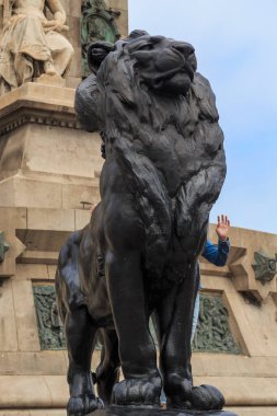 BARCELONA, SPAIN - MAY 10, 2017: This is a figure of one of the bronze lions on the pedestal of the Columbus Monument.