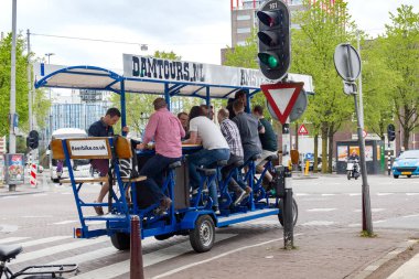 AMSTERDAM, NETHERLANDS - MAY 4, 2013: This is a special bike tour through the city with the opportunity to ride a special cycling machine and drink beer.