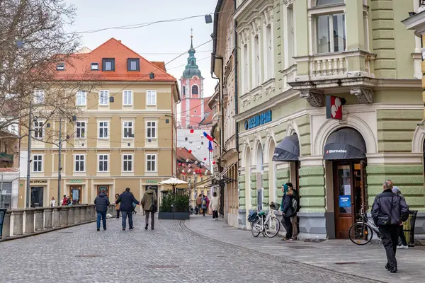 stock image LJUBLIJANA, SLOVENIA - MARTH 7, 2023: This is Wolfova Street in the historical center of the city with buildings from the 19th and 20th centuries.