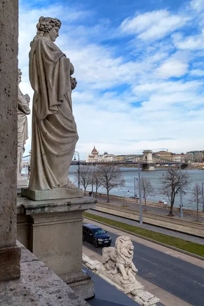 stock image BUDAPEST, HUNGARY - MARTH 14, 2023: This is a view of the Danube from the window of the pavilion with the allegorical figure of Autumn in the Castle Garden Bazaar.