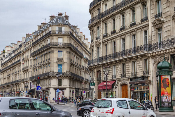 PARIS, FRANCE - MAY 14, 2013: These are houses with architecture typical of the development of the Grand Boulevards of Baron Haussmann (second half of the 19th century)