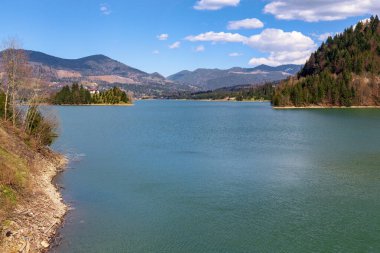 COLIBICA, ROMANIA - MAY 1, 2023: This is a panoramic view of the artificial Colibica Lake, formed by a dam on the Bistrita-Birgaului River.