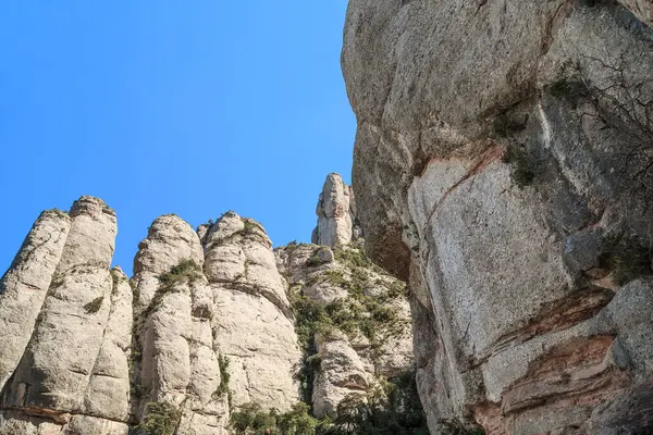 These are the bizarre rocks of the sacred mountain of Montserrat in Spain.