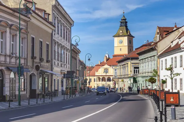 stock image BRASOV, ROMANIA - MAY 2, 2023: This is a street in the old town near the Council Square with the old City Hall.