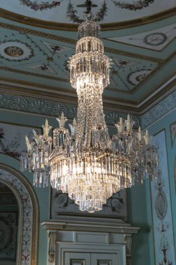 INVERARY, GREAT BRITAIN - SEPTEMBER 12, 2014: This is a crystal chandelier in one of the halls of Inveraray Castle. clipart