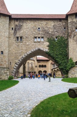 LEOBENDORF, AUSTRIA - MAY 11, 2019: This is the passage between inner courtyards of the medieval Kreuzenstein Castle. clipart