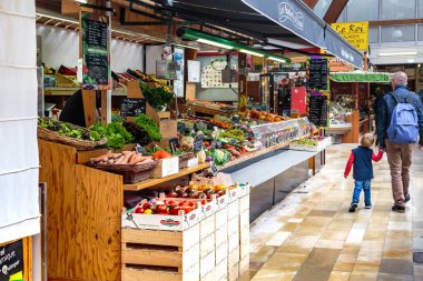 QUIMPER, FRANCE - SEPTEMBER 6, 2019: This is one of the vegetable stalls at the street market. clipart