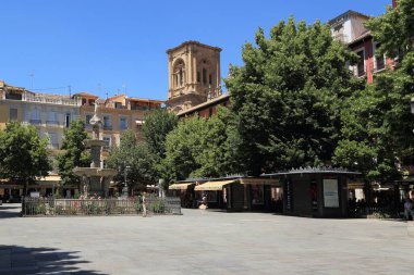 GRANADA, SPAIN - MAY 20, 2017: This is the Bib-Rambla Square with the Fountain of the Giants (17th century) in the historic center of the city. clipart