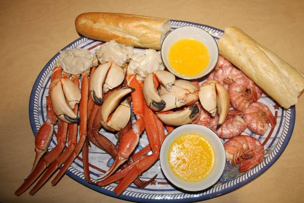 Steamed Crab legs platter with bread and butter